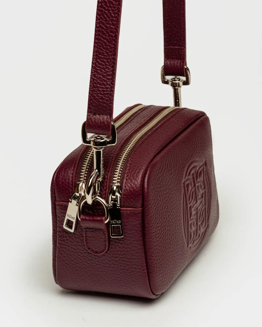 Bandolera New Eterial en cuero graneado burgundy