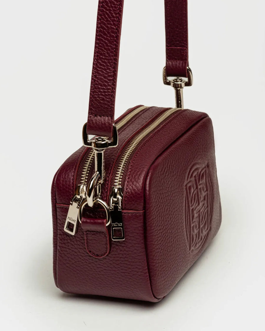 Bandolera New Eterial en cuero graneado burgundy