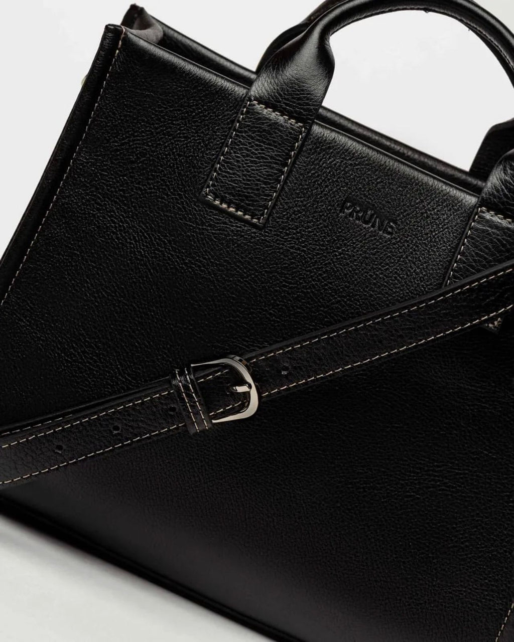 Cartera de mano Capri en cuero arrugado liso negro
